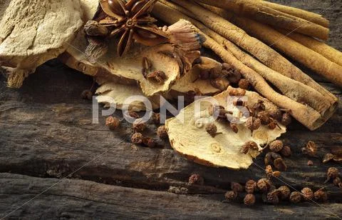 Herb and spice and seasoning on wooden background. Stock Photos
