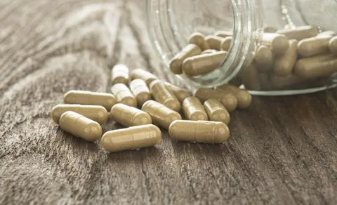 Herb capsule Stock Photos