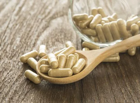 Herb capsule Stock Photos