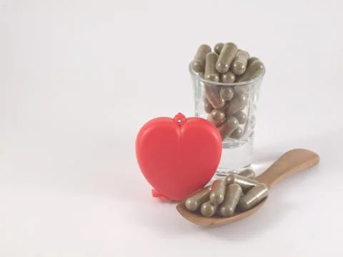 Herb in capsule pill Stock Photos