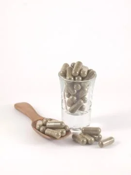 Herb in capsule pill Stock Photos