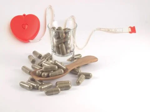 Herb in capsule pill Stock Photos