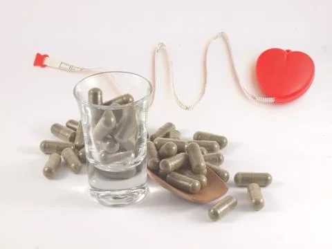 Herb in capsule pill Stock Photos