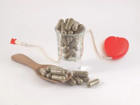 Herb in capsule pill Stock Photos