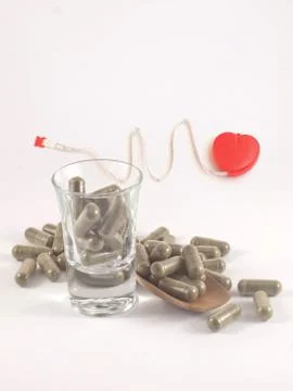 Herb in capsule pill Stock Photos