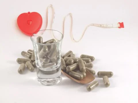 Herb in capsule pill Stock Photos