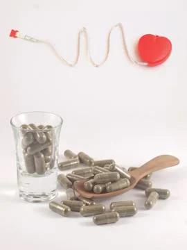Herb in capsule pill Stock Photos