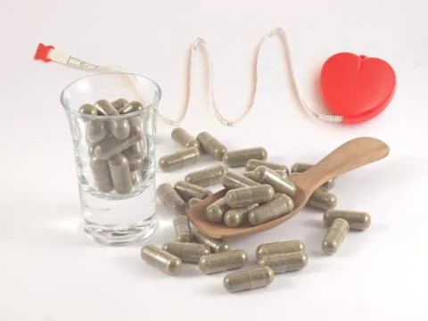 Herb in capsule pill Stock Photos