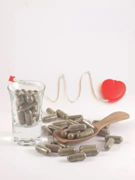 Herb in capsule pill Stock Photos