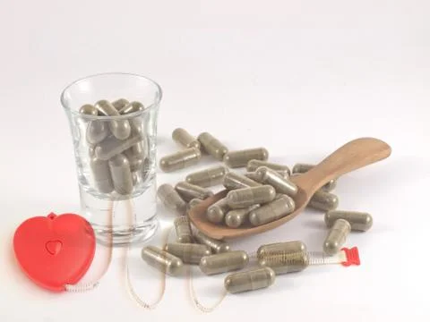 Herb in capsule pill Stock Photos