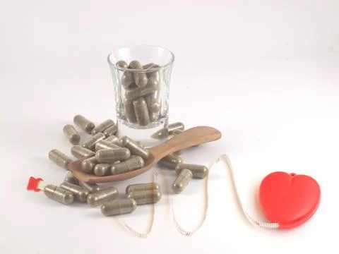 Herb in capsule pill Stock Photos