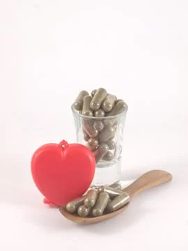 Herb in capsule pill Stock Photos