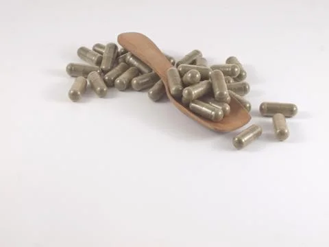 Herb in capsule pill Stock Photos