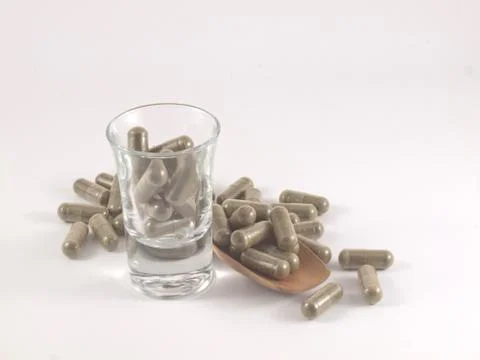 Herb in capsule pill Stock Photos