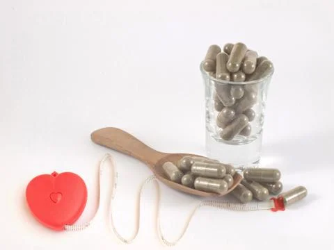 Herb in capsule pill Stock Photos