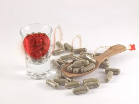 Herb in capsule pill Stock Photos