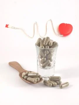 Herb in capsule pill Stock Photos