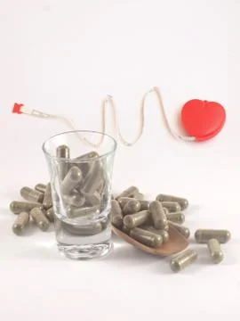 Herb in capsule pill Stock Photos