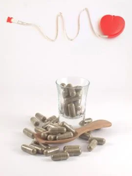 Herb in capsule pill Stock Photos