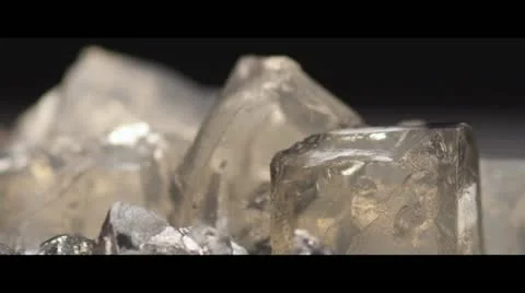 Herb liqueur being poured over ice (close-up) Stock Footage 24672203