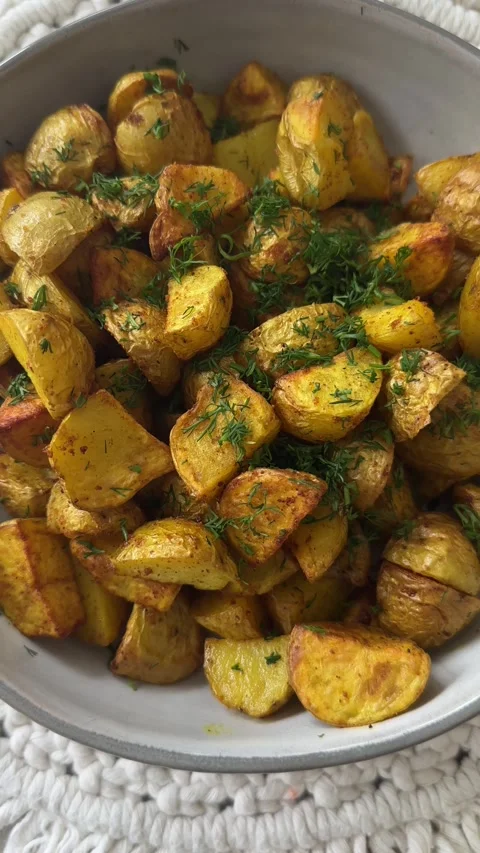 Herb Roasted Potatoes in Bowl Stock Footage 320851396