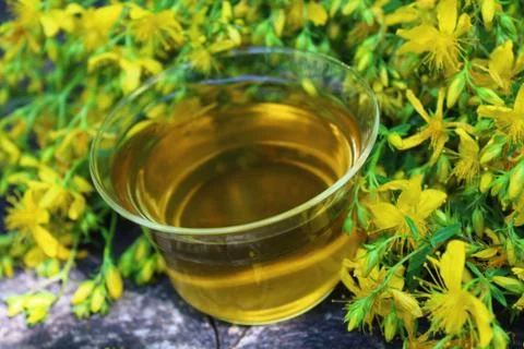 Herb tea on an old weathered tree trunk Stock Photos