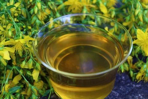 Herb tea on an old weathered tree trunk Stock Photos