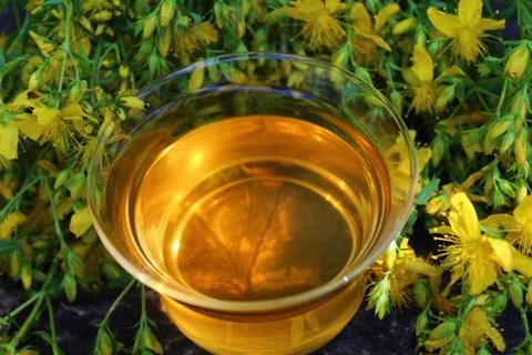 Herb tea on an old weathered tree trunk Stock Photos