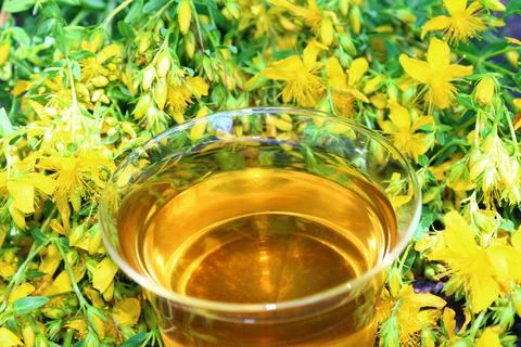 Herb tea on an old weathered tree trunk Stock Photos