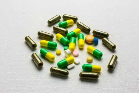 Herbal capsules with tablets and capsules pills Stock Photos