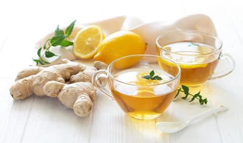 Herbal ginger tea boost your immune, two glass mugs of healthy hot drink Stock Photos