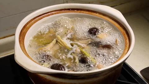 Herbal Soup Boiling in Clay Pot Stock Footage 340775360