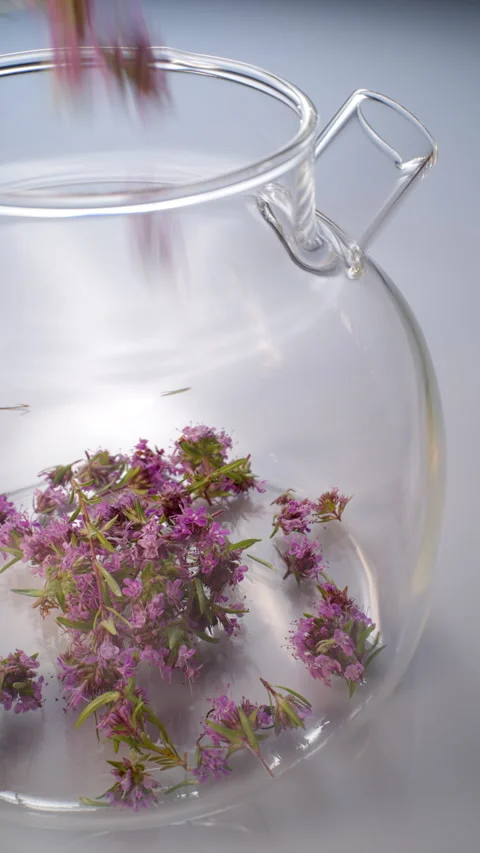 Herbal tea with the blossoms of thyme. Video stock 309893085