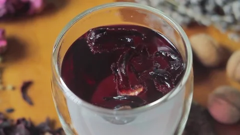 Herbal tea is disturbed by a spoon Stock Footage 74958177