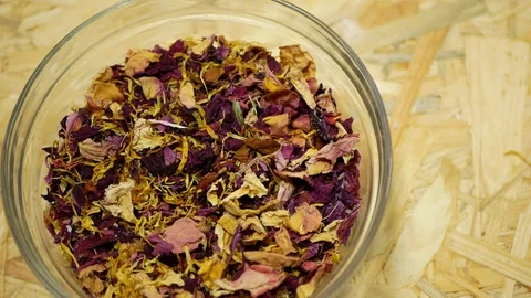 Herbal tea dried blend mixture of rose glass jar cup, cornflower, hibiscus Stock Footage 121814484