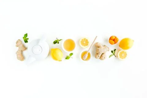 Herbal tea with mint, ginger, lemon, honey and other herbs on white background Stock Photos