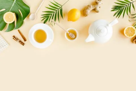 Herbal tea with mint, ginger, lemon, honey and other herbs on yellow background Stock Photos