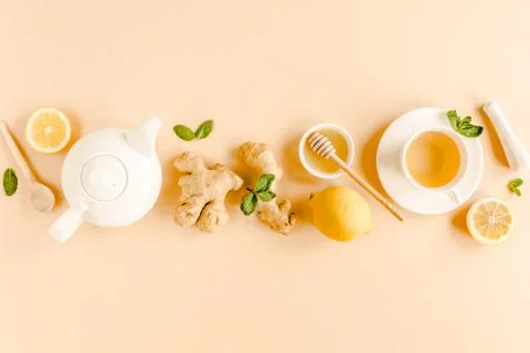 Herbal tea with mint, ginger, lemon, honey and other herbs on yellow background Stock Photos