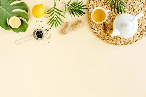 Herbal tea with mint, ginger, lemon, honey and other herbs on yellow background Stock Photos