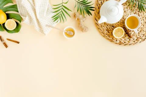 Herbal tea with mint, ginger, lemon, honey and other herbs on yellow background Stock Photos