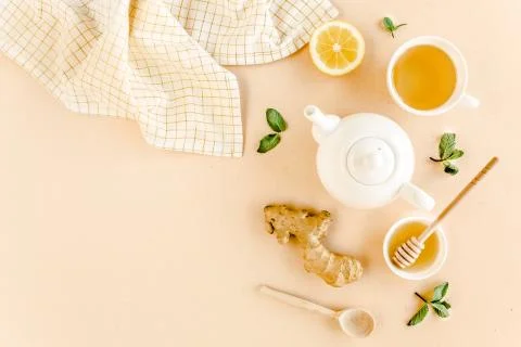 Herbal tea with mint, ginger, lemon, honey and other herbs on yellow background Stock Photos
