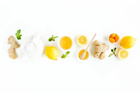 Herbal tea with mint, ginger, lemon, honey and other herbs on white background Stock Photos
