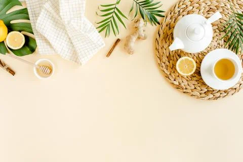 Herbal tea with mint, ginger, lemon, honey and other herbs on yellow background Stock Photos