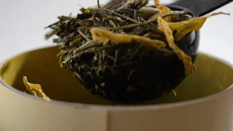 Herbal tea is mixed with a spoon Stock Footage 123904957
