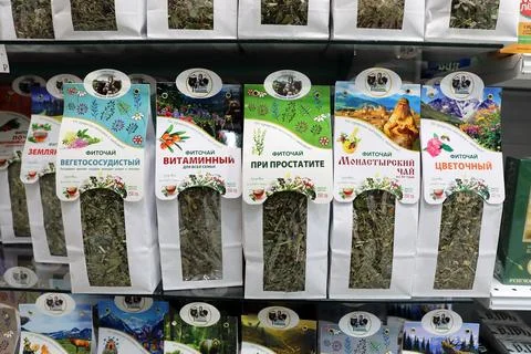 Herbal tea in packages on the pharmacy window Stock Photos