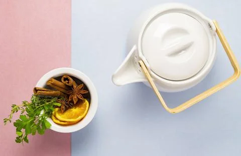 Herbal tea on pascal color background rose and blue - thymian cinnamon lemon Stock Photos