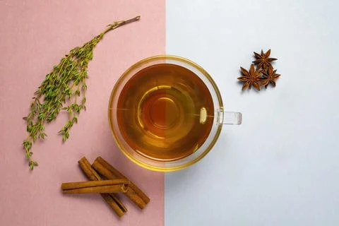 Herbal tea on pascal color background rose and blue - thymian cinnamon lemon Stock Photos