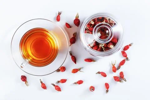 Herbal tea from rose hips, vitamin drink, hips, based on white, top view. Stock Photos