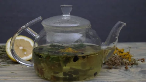 Herbal tea rotates in a teapot Video stock 178427398