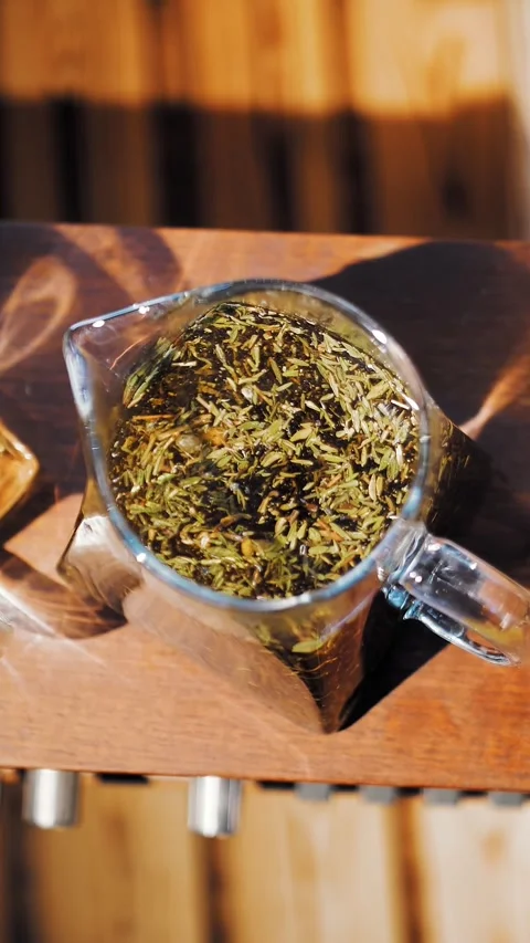 Herbal tea in a teapot. tea drink. close-up. top view. three glass teapots with Stock Footage 323515873